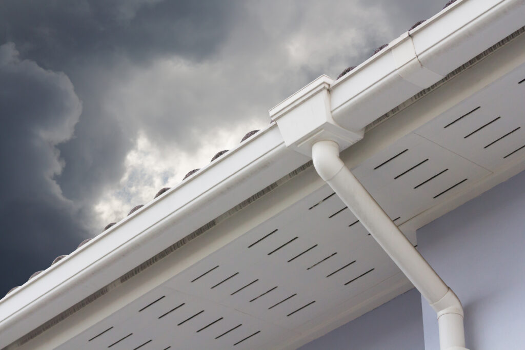 Gutter replacement contractors - a white rain gutter