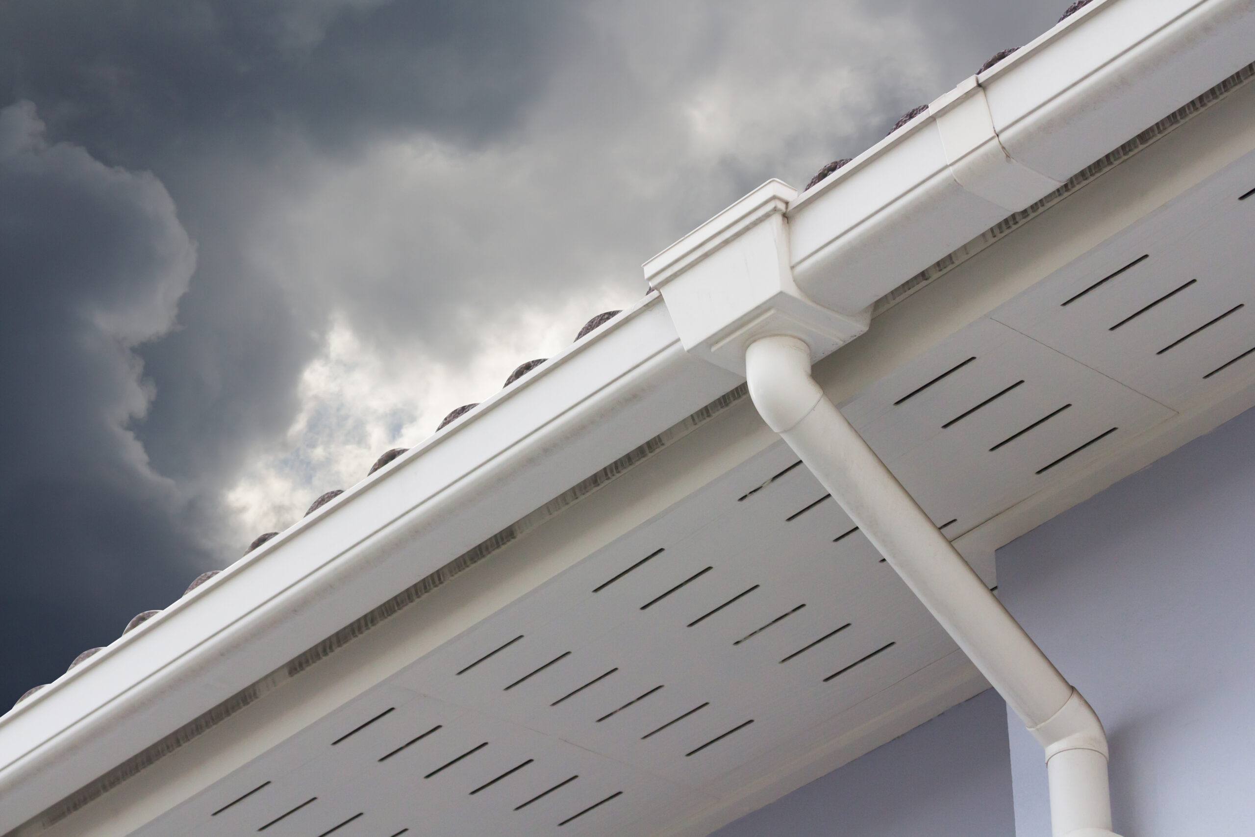 Gutter replacement contractors Louisville, KY - a white rain gutter