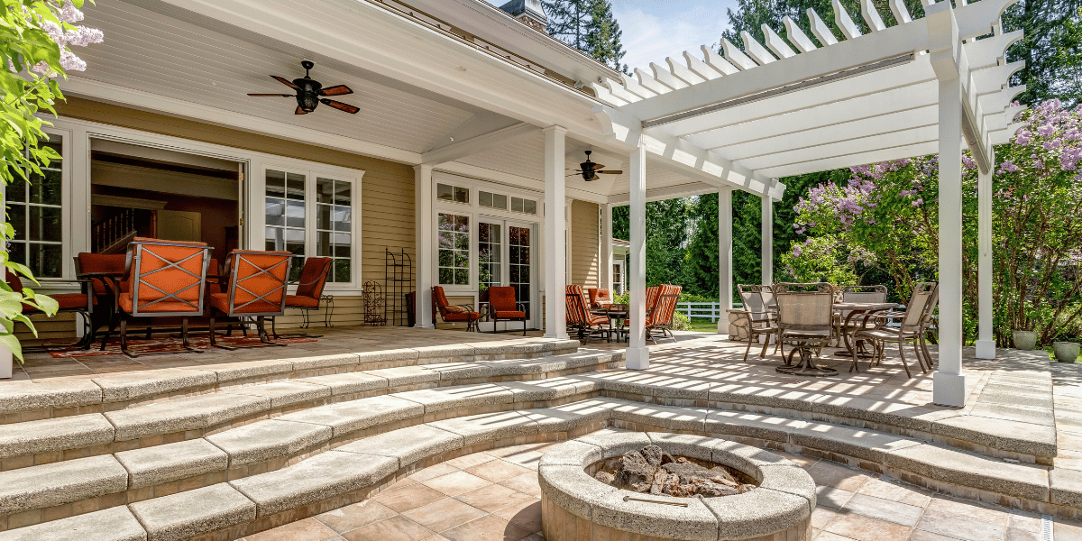 Three Home Improvement Projects To Get Your Home Ready for Summer Fun - featured image stone patio with fire pit
