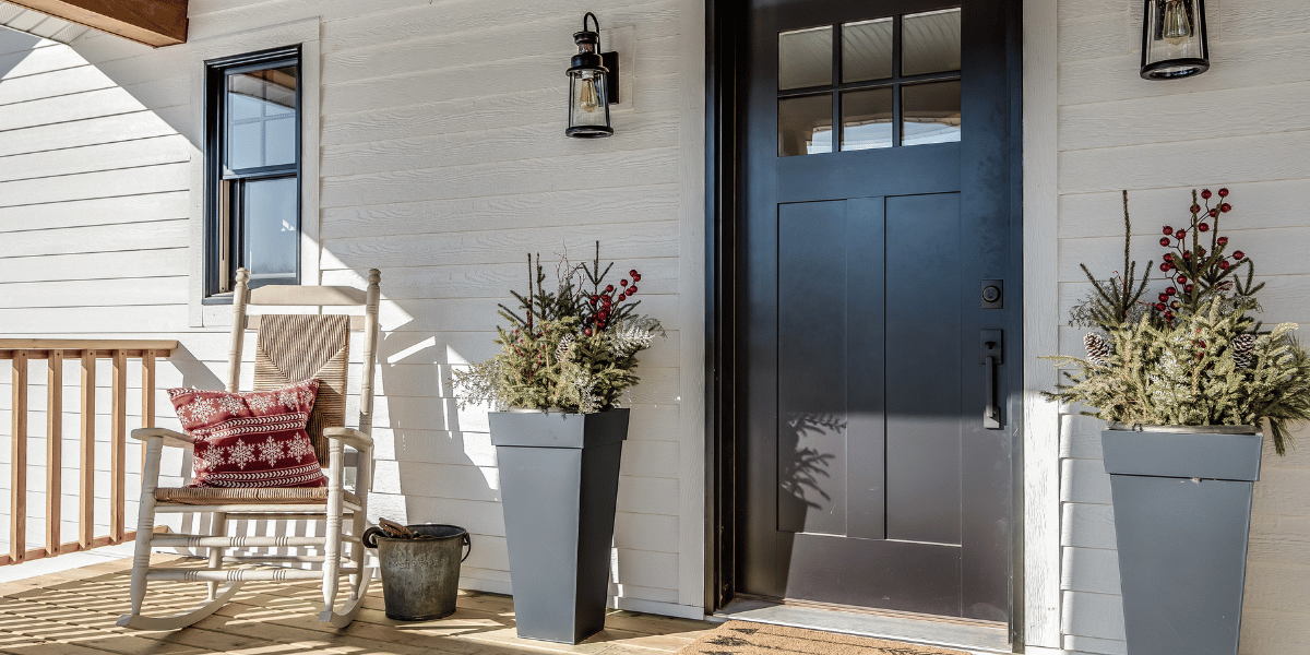 custom porch builders Louisville KY - front porch with planters and chair