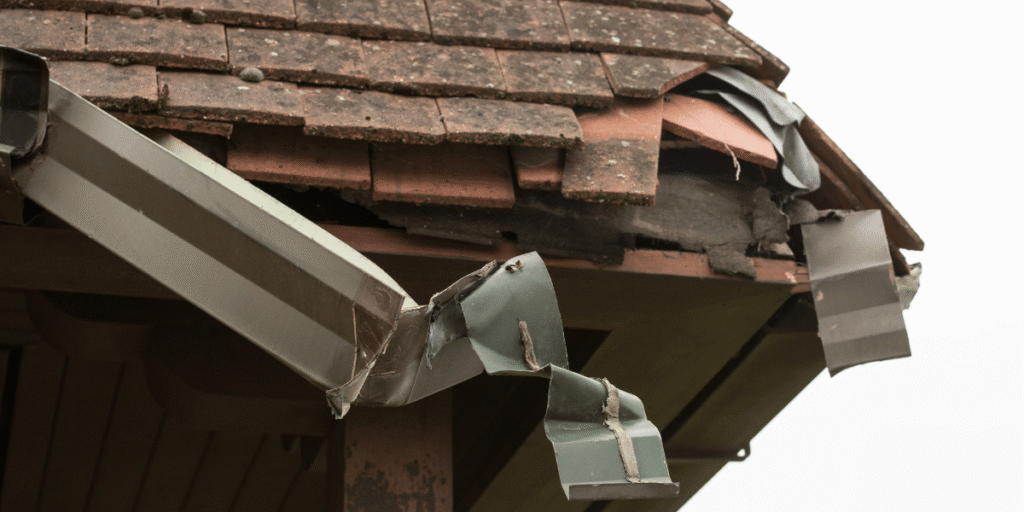 storm damage contractors jeffersontown ky - damage to roof and gutter
