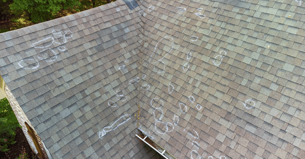 storm damage repair lyndon ky - roof with damaged areas marked off